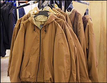 Industrial workwear jackets on rack
